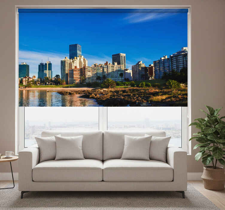 Living room roller blind with montevideo views - TenStickers