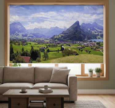 Rolgordijn woonkamer huizen op een groen veld met bergen - TenStickers