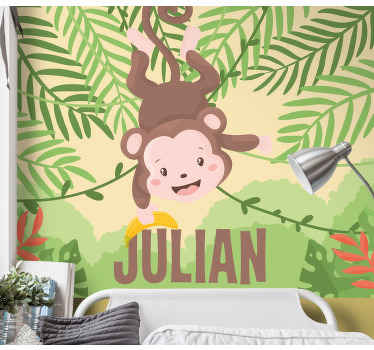 Cute baby monkey hanging on branch wall mural - TenStickers