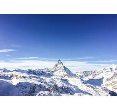 This scenery photo wallpaper shows the fantastic mountain Matterhorn in winter. Especially the color blue is looking great in your home.