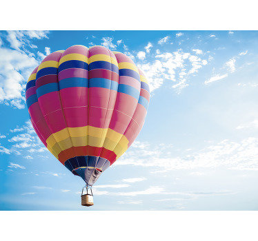 A large colourful vintage air balloon wall mural that is created with a beautiful atmospheric blue sky that will change the look of your wall at home.