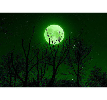 Magnificent landscapes wall mural with a photo of the night sky with a majestic green moon illuminating the forest, perfect for your living room.