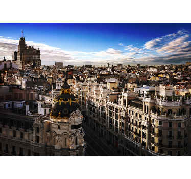 Fotomural Madrid Gran vía con nubes al atardecer - TenVinilo