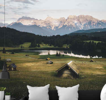 Fototapeta góry i słoneczne pole z domkami - TenStickers