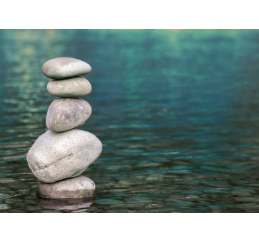 Zen canvas wall art which features an image of a pile of 5 pebbles all stacked on top of each other in a body of water. Choose your size.