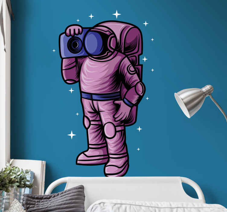 Astronaut holding radio tape decal for bedroom - TenStickers