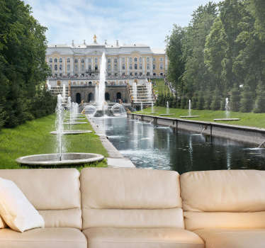 Photo Mural - Shot of a relaxing garden with green grass, trees and water fountains. Ideal piece for the home.