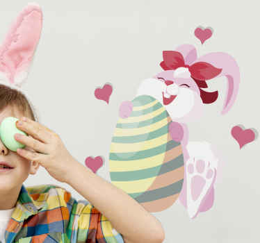 Easter bunny sitting and holding egg decal - TenStickers