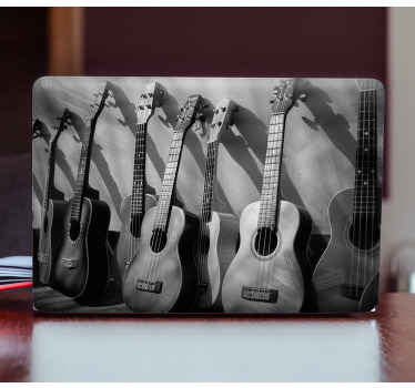 Guitars on a white background laptop decal - TenStickers