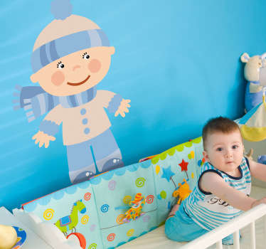 Vinil decorativo de uma ilustração de um bébe pequeno vestido para dias de inverno. Adesivo de parede para decoração de interiores.