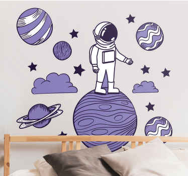 Naklejka kosmos na ścianę Astronauta rysuje z planetami - TenStickers