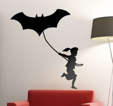 Vinilos originales con el perfil silueteado de una niña haciendo volar una cometa con el emblema del hombre murciélago.