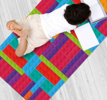 Children's rug which features a collection of coloured bricks perfectly put together. It has wonderful shades of blue, green, orange, purple and red.