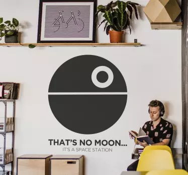 The wall decoration consists of the death star with the text "That's no moon...it's a space station" written underneath.