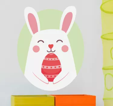 A wall sticker for children in which the Easter Bunny is holding a coloured egg. A nice wall decoration for Easter.