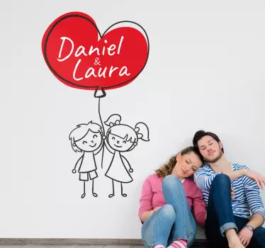 Personalized vinyl with the drawing of a couple holding a heart-shaped balloon with names. Create a cozy atmosphere and fill your rooms with love!
