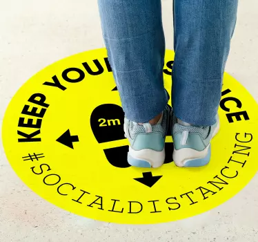 Social distancing floor sign sticker design made on a round yellow background surface with warning text. Recommended for hospitals and  public places.