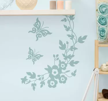 Ornamental flower wall sticker design that is customizable in a range of colour options. The flower design is made in swirling style with butterflies.