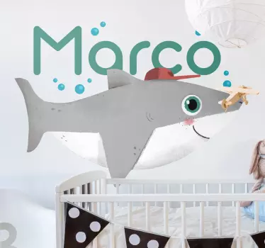 Illustrative baby shark fish sticker ideal to decorate the room of children. The fish is depicted to be under water with air bubbles from it breath.