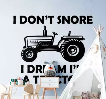 Decorative customizable colour toy tractor with text sticker for kids. The inscription on the toy tractor says 'I don't snore, I dream I'm a tractor'.