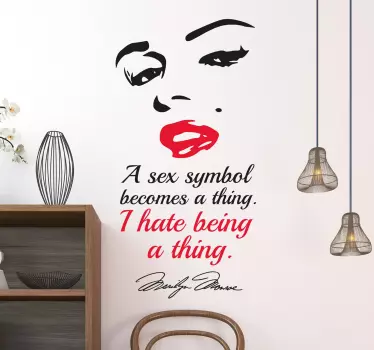 Character wall sticker design of Marilyn Monroe pretty face with the quote ''A sexy symbol becomes a thing, i hate being a thing''.